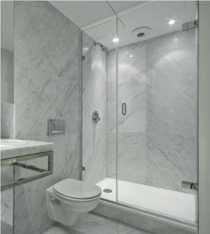 Marble bathroom with glass shower enclosure