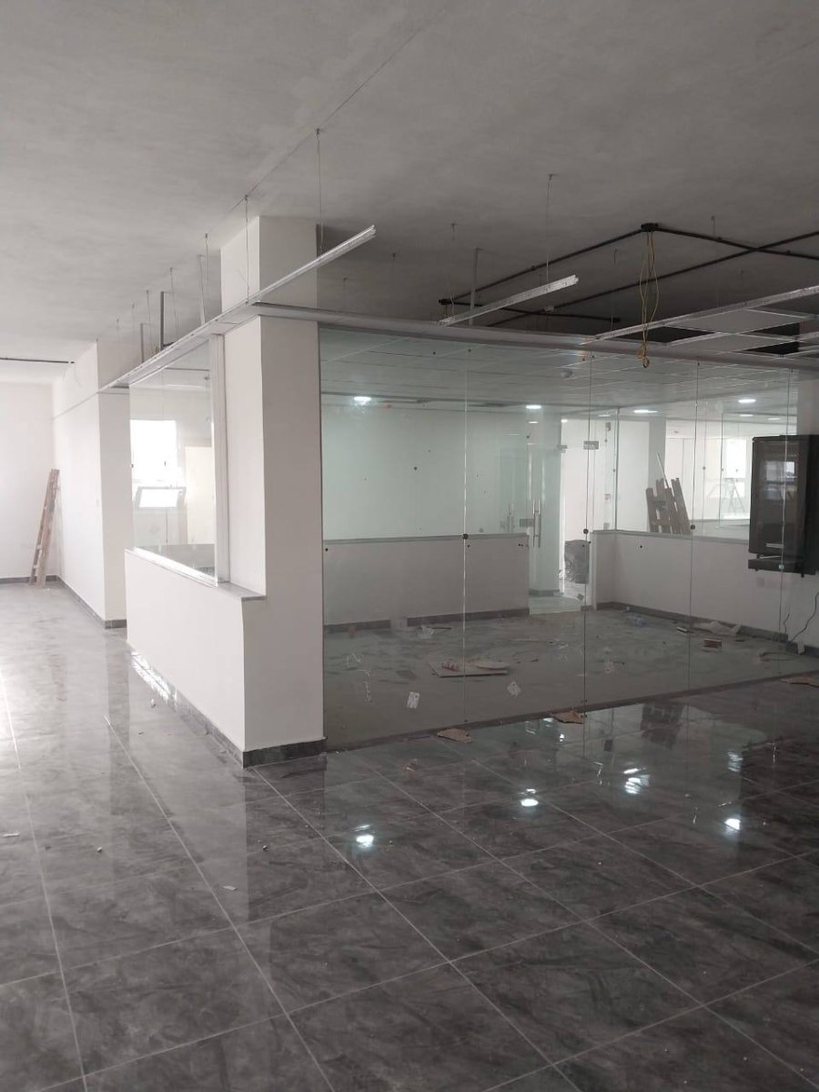 Glass conference room partitions in office